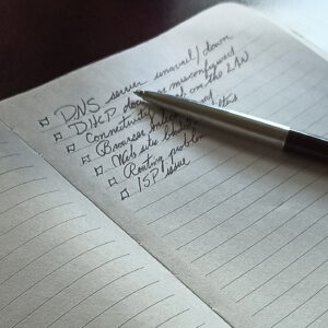 2018-02-06-Building The Team Paper booklet with writing on it and a pen.