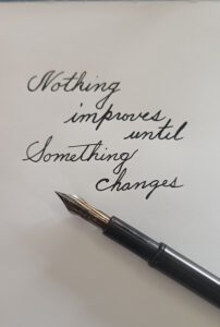 Handwritten page with fountain pen that says Nothing improves until something changes